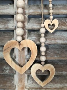 two wooden hearts hanging from a string