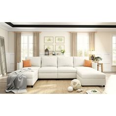 a large white sectional couch in a living room