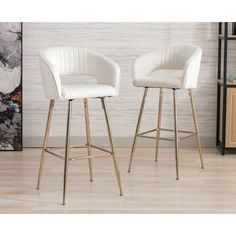 two white bar stools sitting next to each other