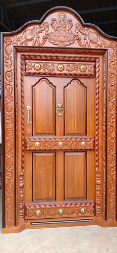 an intricately carved wooden door is shown