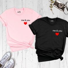 Celebrate love in style with our Couple Matching Me and You Love Shirt, the perfect expression of togetherness and affection. Elevate your Valentine's Day with our charming Valentines Day Tshirt, featuring a delightful design that captures the essence of romance. Adorned with a Red Heart Me and You Shirt, our collection embodies the spirit of love and unity. Whether you're looking for a Men Ladies Lover Outfit or a Cute Valentine Couple Tee, our range is curated to complement your unique bond. E Couple Tshirts Unique, Valentines Couple Shirt Ideas, Valentine's Day Gift T-shirt With Heart Graphic, Casual Valentine's Day T-shirt With Graphic Print, Lover Outfit, Valentine Couple, Valentine's Day White T-shirt With Text Print, Coordinated Outfits, Cheap Couples T-shirt For Valentine's Day