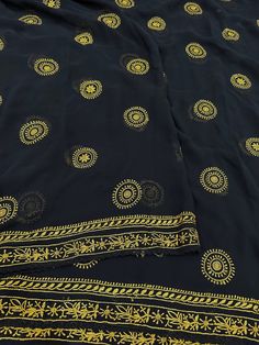 Pure georgette Chikankari saree with hand embroidery. Yellow motifs skillfully embroidered with fine resham thread. Fall Attached. No blouse piece. Diwali Black Saree With Chikankari Embroidery, Navratri Chikankari Embroidery Blouse In Georgette, Black Traditional Saree With Chikankari Embroidery, Traditional Black Saree With Chikankari Embroidery, Black Saree With Chikankari Embroidery, Festive Black Saree With Chikankari Embroidery, Embroidered Anarkali Blouse Piece In Georgette, Black Chanderi Fabric With Chikankari Embroidery, Traditional Unstitched Blouse Piece In Georgette