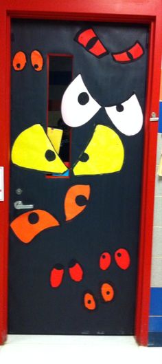 a door decorated with an angry bird and red frame for the entrance to a classroom