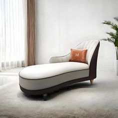 a white chaise lounge chair sitting next to a potted plant in front of a window