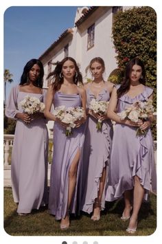 the bridesmaids are all dressed in lavender colored dresses and holding bouquets with white flowers