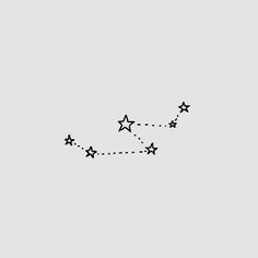 an airplane flying in the sky with five stars on it's tail and one star above