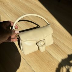 Selling My Pillow Tabby In Ivory. It Is In Great Condition With Minor Wear On The Side (Pictured). Comes With Dust Bag, Short And Long Strap. Nappa Leather Inside Multifunction Pocket Snap Closure, Leather Lining Detachable Handle With 4" Drop Detachable Long Strap With 21 1/2" Drop For Shoulder Or Crossbody Wear 7 1/4" (L) X 4" (H) X 2 1/2" (W) Style No. C3880 Coach Pillow Tabby, Coach Pillows, Tabby Shoulder Bag, My Pillow, Ivory Color, Nappa Leather, 4 H, Snap Closure, Dust Bag