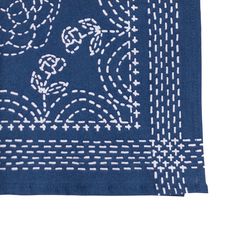 a blue bandana with white designs on it