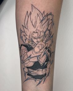 a tattoo on the leg of a person with an image of gohan and trunks