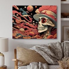 a living room with a couch, chair and painting on the wall that has an image of a skull wearing a hat