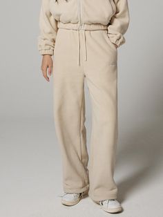 Editor's NotesThese comfy and warm wide pants are made from double side micro fleece fabric  and designed with jogger silhouette that's versatile for casual street mood styling. Wear yours with 'Oversized Cropped Fleece Zip-Up Hoodie' for set-up look.- Elasticated drawstring waistband- Two front slash pockets- Logo embroidery at front- Two back welt pockets- Adjustable drawcord at hem- Wide fit- Extend length options is availableMeasurements (in.)Size: S / S+ / M / M+- Total Length: 39.0 in. / 40.9 in. / 39.8 in. / 41.7 in.- Waist: 12.4 in. / 12.4 in. / 13.2 in. / 13.2 in.- Hip: 20.3 in. / 20.3 in. / 21.3 in. / 21.3 in.- Thigh: 12.8 in. / 12.8 in. / 13.4 in. / 13.4 in.- Rise: 12.2 in. / 12.2 in. / 12.6 in. / 12.6 in.- Hem: 10.2 in. / 10.2 in. / 10.6 in. / 10.6 in.* Model Info: Woman - 5' 6 Winter Wide-leg Leisure Sweatpants, Winter Wide Leg Sweatpants For Leisure, Winter Leisure Wide Leg Sweatpants, Wide Leg Winter Sweatpants For Leisure, Winter Wide Leg Sweatpants With Elastic Waistband, Winter Solid Color Wide-leg Sweatpants, Wide Leg Beige Sweatpants For Winter, Winter Wide-leg Sweatpants With Elastic Waistband, Winter Wide Leg Joggers With Elastic Waistband