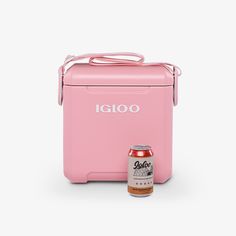 the igloo cooler is pink and has a bottle next to it