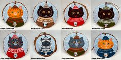 six ornaments with cats wearing sweaters and hats on them, all in different colors