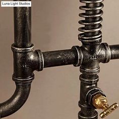 the pipes are connected to each other with brass fittings on them and there is also a light bulb