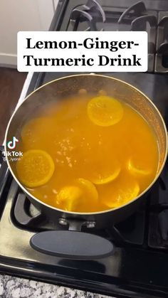 lemon - ginger - turmeric drink in a pan on the stove with text overlay