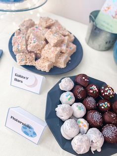 there are many different desserts on the table with name tags in front of them