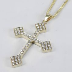 "Cross pendant necklace made of solid 14k yellow gold, set with fiery natural diamonds. This cross is handmade in our family workshop, by making it I use solid 14k yellow gold and premium quality diamonds that will shine forever. ✔ Packed in a jewelry box ✔ Free DHL worldwide shipping ✔ Certificate of authenticity included Specs: MATERIAL: 14K solid yellow gold 2.70 gram DIAMONDS: 53 natural diamonds CT WEIGHT: 0.44 ct weight total CLARITY: SI1 COLOR: G/H LENGTH: 32 mm/ 1.25\" Width : 20 mm/ 0.80\" CHAIN: Cable chain in 14k yellow gold, 2.50 gram Available in white gold. * If you like my shop and designs, please give them your warmest ♥.  * If you can't find what you are looking for we can make it for you. * We offer flexible payment plans. Thank you for visiting my store and you are more Diamond Cross Necklace, Orthodox Cross, White Gold Pendant Necklace, Packing Jewelry, Gold Cross Pendant, Diamond Cross Pendants, Personalized Pendant, Diamond Cross, Cross Pendant Necklace