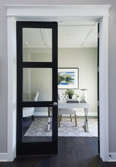 an open door leading into a white room