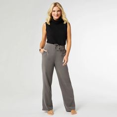 Indulge your senses with our Smooth Wide Leg Pant. Experience the luxuriously soft touch of its fabric, perfectly complemented by the gentle stretch for a perfect fit. The elastic back and smooth front offer optimal comfort, while the tie waistband and practical pockets add functionality and style. The everstretch line is a personal favorite of store staff! Polyester/Spandex See size chart in product photos Poncho Jacket, Wide Leg Pant, Pocket Leggings, Sweaters And Jeans, Jeans Dress, Skirt Pants, Wide Leg Jeans, Black Leggings, Black Hoodie