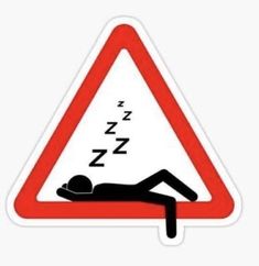 a red and white triangle sign with a person laying on it's back next to a sleeping man