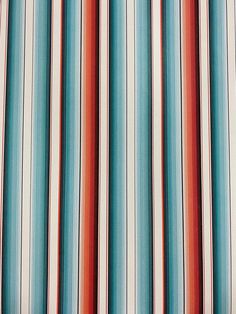 an orange, blue and white striped curtain