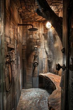 a rustic bathroom with stone flooring and wooden walls, along with an outdoor shower