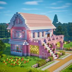 a pink house with lots of windows and flowers on the front porch is shown in minecraft