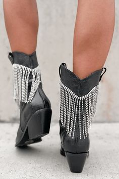 Brand: Billini Color: Black Faux Leather Uppers Crinkled Textured Western Style Rhinestone Fringe Detailing Pointed Toe 2.75" Heel Runs 1/2 Size Big - Size Down Launched: 12/20/23 Summer Party Boots With Rhinestones, Spring Boots With Rhinestone Fringe, Black Rhinestone Boots For Spring, Black Boots With Rhinestone Fringe For Party, Black Rhinestone Fringe Boots For Party, Black Pointed Toe Boots For Western-themed Events, Black Western Boots With Rhinestone Rivets, Black Studded Cowboy Boots, Black Boots Fringe