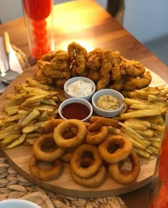 a platter filled with fried food and dipping sauces