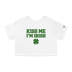 "Elevate your St. Patrick's Day style with our Kiss My I'm Irish Shamrock Champion Women's Heritage Cropped T-Shirt! Crafted for the festive spirit, this tee combines comfort with flair, making it a must-have addition to your St. Paddy's wardrobe. Made from premium quality cotton blend fabric, this cropped tee offers a flattering fit that's both comfortable and stylish. The Champion brand ensures top-notch quality, ensuring durability for long-lasting wear. With its trendy cropped design, it's p St. Patrick's Day Graphic Print Crew Neck Top, St. Patrick's Day Cotton Crew Neck Tops, Cotton Crew Neck Top For St. Patrick's Day, Cotton Top With Letter Print For St. Patrick's Day, Irish Cheers, Playful Kiss, St Paddys, Irish Shamrock, Champion Brand