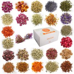 the box is full of different types of dried flowers and incense sticks, all in various colors