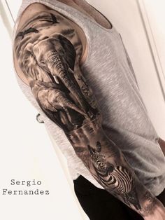 a man with an elephant and zebra tattoo on his arm