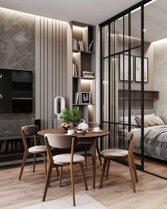 a dining table and chairs in a room with wood flooring on the side wall