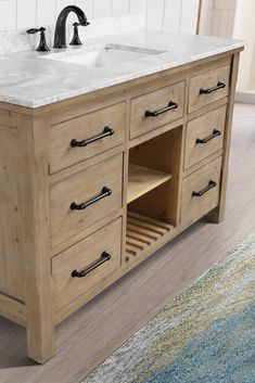 a bathroom vanity with two sinks and an area rug