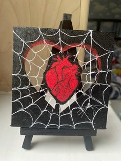 a spider web with a heart on it