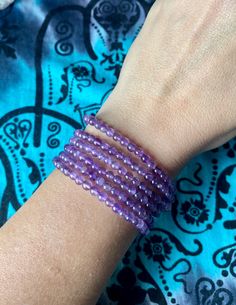 Bracelet made with 4mm Amethyst beads on a stretchy string. Easy to go on and take off any size wrist.  Beautiful bright purple coloring with some having a  flash of rainbow.  *Selenite Tower is for display use only. Not included in purchase.  Amethyst helps with relieving stress, soothing irritability, balancing mood swings, dispelling anger and anxiety.   It activates spiritual awareness, opens intuition and enhances psychic abilities.   Associates well with the Crown and Third Eye Chakras. Selenite Tower, Chesapeake Va, Spiritual Awareness, Amethyst Beads, Bright Purple, Mood Swings, Psychic Abilities, One 1, Third Eye