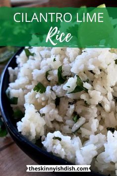 a bowl filled with rice and garnished with cilantro lime