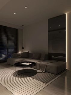 a living room filled with furniture next to a window covered in blinds and shades on the windows