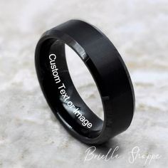 This modern, black Tungsten Carbide ring is available in your choice of 6mm or 8mm width. Personalized Laser Engraving (inside of band) Free Ring Box Nickel Binder, 100% Cobalt Free These are some of the engraving services we offer... **your handwriting **your unique heartbeat line **unique custom made logo **many different languages **many different fonts **heart, cross, infinity, flowers, paw prints & many more **Please message me if you have a special request. Tungsten rings are extremely scr Classic Black Customizable Jewelry, Customizable Black Promise Jewelry, Modern Black Jewelry For Wedding, Customizable Black Jewelry For Formal Occasions, Customizable Black Rings For Gifts, Elegant Black Tungsten Carbide Rings, Customizable Black Wedding Jewelry, Modern Black Tungsten Carbide Jewelry, Personalized Black Wedding Jewelry