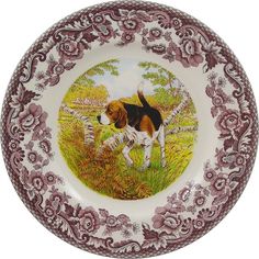 a brown and white dog is on a plate with purple flowers around the border,