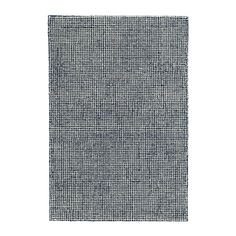 a black and white rug with small squares on the bottom, in front of a white background