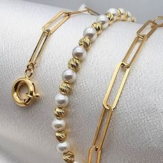 18k real gold Beaded/Paperclip chain set of necklace & bracelet complimented with imitation pearls and spring ring closures.  5mm thickness Best birthday/anniversary gift. Handmade in our shop. -Necklace: *18 inches, 5mm, 8.66gr* -Bracelet: *7 inches, 6mm, 3.89gr* *750 Certified, stamped* Highest quality of gold ONLY REAL GOLD Priced to sell! Compare our prices to other similar sellers! Arrives in a GIFT BOX and includes FREE SHIPPING within the USA and Canada and all over the world. LIFETIME IN THE JEWELRY BUSINESS.  Second-generation family member making gold and jewelry.  Please feel free to ask us any questions - Always happy to help! Fast Replies to messages! Superior Quality and Best Prices! Gold Paperclip Bracelet With Pearl Chain As A Gift, Elegant Paperclip Bracelet With Pearl Chain, 18k Gold Bangle, European Jewelry, Gold Wrap, Gold Birthday, Solid Gold Jewelry, Gold Price, Jewelry Business