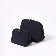 This pouch set is here to help you organize your daily essentials and make travel a little easier. With two compact pieces, everything will be neatly zipped up and perfectly organized. Plus, these pouches are machine washable, adding convenience to your organizational bliss. Versatile Cheap Black Pouch, Versatile Black Cosmetic Bag, Black Cosmetic Bag With Zipper For On-the-go, Black Zipper Pouch Cosmetic Bag For On-the-go, Black Rectangular Cosmetic Bag With Zipper, Portable Black Cosmetic Bag For On-the-go, Versatile Black Cosmetic Bag For Travel, Black Practical Travel Accessories With Zipper, Black Practical Travel Accessories With Zipper Closure