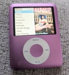 an ipod sitting on top of a carpet