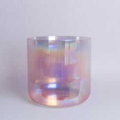 a glass vase sitting on top of a white table