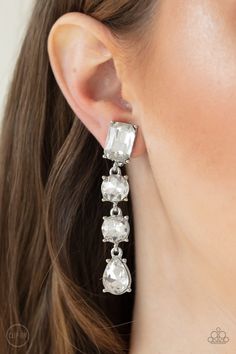 MAKE A-LIST - WHITE Featuring a glassy white finish, a collection of emerald, round, and teardrop cut rhinestones drip from the ear, connecting into a glamorous lure. Earring attaches to a standard clip-on fitting. Sold as one pair of clip-on earrings. P5CO-WTXX-105XX ORDERED 13 AUG 20 Bedazzled Jewelry, Paparazzi Jewelry Images, Concert Fashion, Paparazzi Accessories, White Rhinestone, The Ear, Lists To Make, Chic Jewelry, Silver Bars