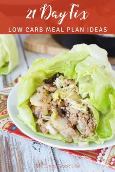 lettuce wraps filled with meat and vegetables on a plate next to a skillet