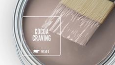 a paint can with a brush in it and the words cocoa crayon on it