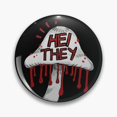 a button with the words he they on it and dripping blood coming out of it