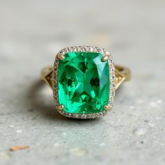 8 Crt Cushion Emerald Ring - 14k Gold Natural Emerald Ring - Big Emerald Ring - Diamond Emerald Ring - Top Quality Emerald Ring Women  GEMSTONE DETAILS : ✦ Gemstone : Natural Zambia Emerald ✦ Gemstone Size : 8x11 mm ✦ Gemstone Shape : Cushion Cut ✦ Number of Gemstones : 1 ✦ Gemstone Weight : 8 Carat ✦ Gemstone Grade : Vivid  DIAMOND DETAILS : ✦ Diamond Type : Natural ✦ Diamond Size : 1.5 MM ✦ Diamond Color : G-H ✦ Diamond Clarity : Slightly included ✦ Diamond Cut : Excellent ✦ Diamond Weight : 0.50 Carat METAL DETAILS : ✦ Metal : 14K/18K /22K Gold ✦ Metal Color : Yellow / White / Rose Gold ✦ Setting : Prong Setting ✦ Box : Yes SHIPPING DETAILS : ✦ Production time : 3-4 days ✦ Delivery time : 7-8 days ✦ Expedited shipping : Available ✦ Expedited shipping service : UPS ✦ Expedited shipping t Real Emerald Necklace, Mens Emerald Rings, Diamond Emerald Ring, Smaragd Ring, Natural Emerald Rings, Rainbow Sapphires, Emerald Pendant, Emerald Necklace, Emerald Earrings